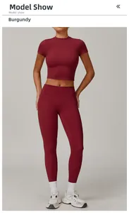 Front view of peach red high-waist yoga leggings and short sleeve crop top set