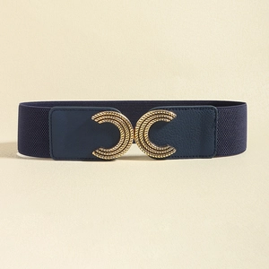 Detail of navy elastic belt featuring golden double-C buckle with embossed texture