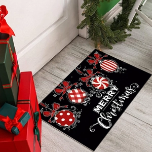 Black Christmas door mat with red ornaments and Merry Christmas text on wood floor