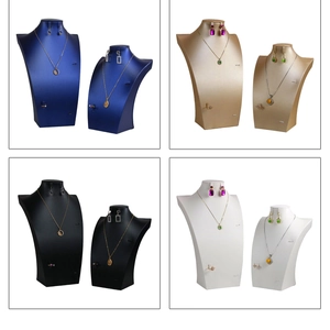 Detailed view of brushed jewelry display stands in blue, gold, black, and white colors