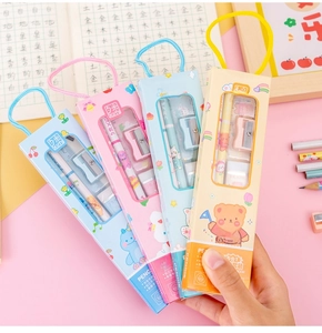 Hand holding 5-in-1 school stationery gift sets with cartoon bears in macaron colors