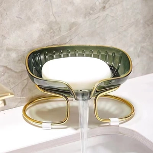 Modern emerald green leaf soap dish with gold metal stand and water drainage flow
