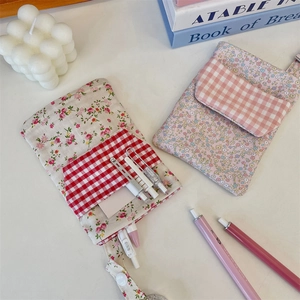 Floral fabric nurse pocket protector and pencil case organizer with a lanyard strap