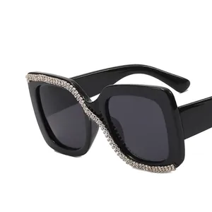 Square oversized sunglasses with black frame and sparkly crystal rhinestone accents