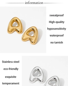 Detailed view of puff letter A stainless steel stud earrings in gold and silver finish