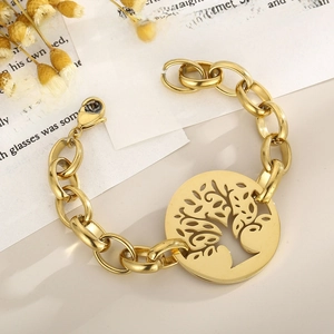 Macro detail of gold Tree of Life charm and lobster clasp on a thick metal link chain