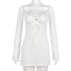 White waffle knit long sleeve mini dress featuring a square neck and lace-up cutout front