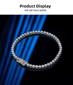 Macro detail of bezel set 2mm moissanite tennis bracelet with secure double clasp