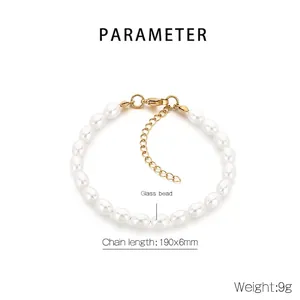 Detail view of oval white glass bead bracelet with gold lobster clasp, 190x6mm size
