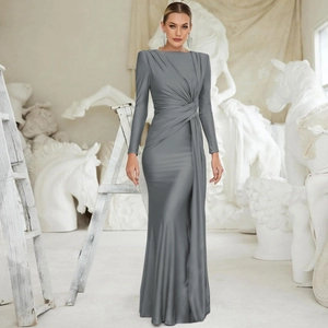 Detail of elegant grey long sleeve maxi dress featuring sophisticated waist draping and pleats