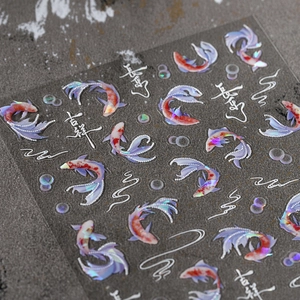 Holographic koi fish nail stickers with Chinese calligraphy on a stone textured surface