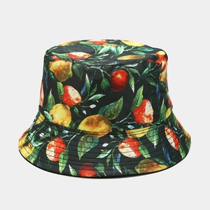 Close-up of tropical fruit print fabric and durable stitching on a black bucket hat