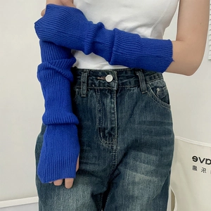 Close-up of bright blue ribbed knit arm sleeves with fingerless long design