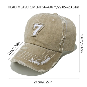 Detail of vintage khaki baseball cap featuring distressed fabric and Lucky number embroidery