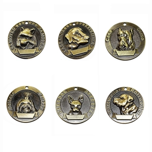 Antique bronze dog ID tags featuring embossed canine portraits for pet collars