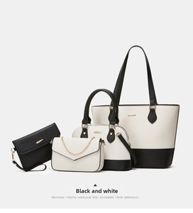 Detail showing a 4-piece set of black and white tote bags with golden hardware