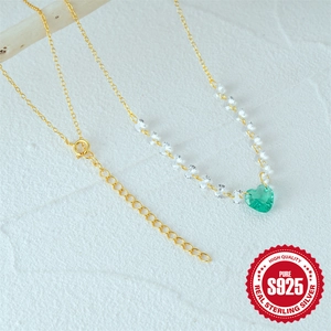 Elegant S925 sterling silver heart necklace with green gemstone on a golden chain