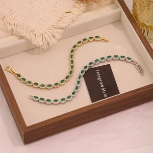 Detailed close-up of emerald green zircon bracelets in gold and silver plating