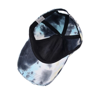 Detail of cotton tie-dye baseball cap interior showing sweatband and metal buckle