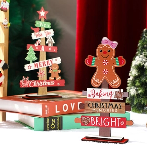 Wooden Christmas gingerbread man and tree tabletop ornaments with festive lettering