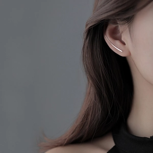 Minimalist silver curved bar stud earrings with sleek streamline design for women