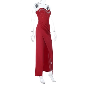 Close-up of red strapless satin gown with sparkling rhinestone trim and high side slit