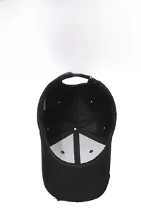 Detail view of black distressed baseball cap showing inner seams and breathable eyelets