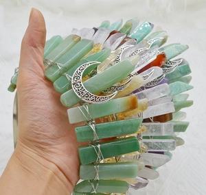 Detail of handmade crystal crown headband with raw stones and silver crescent moon accents