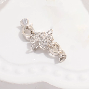 Detailed macro view of S925 silver flower clasp with cubic zirconia for jewelry DIY