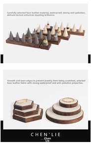 Detail of walnut wood jewelry display set with beige leatherette ring cones and stands