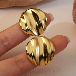 Chic golden textured stud earrings with a stylish wave pattern for women's fashion