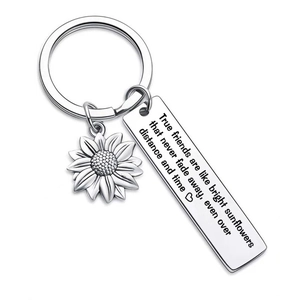 Polished sunflower keychain with engraved rectangular pendant on white background