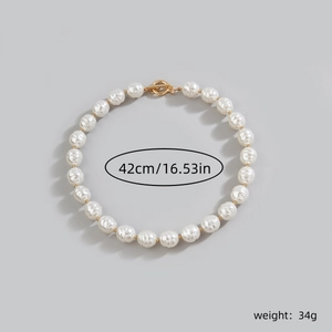 Detailed view of 42cm baroque pearl necklace with gold clasp and 34g weight specifications