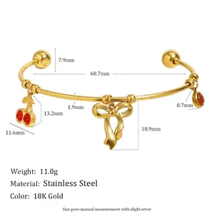 Bracelet jonc en acier inoxydable doré 18K avec cerises rouges et nœud