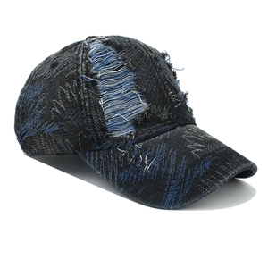 Vintage washed denim baseball cap with distressed rip details and blue contrast stitching