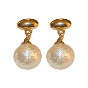 Vintage gold oval earrings with textured white cotton imitation pearls on white background