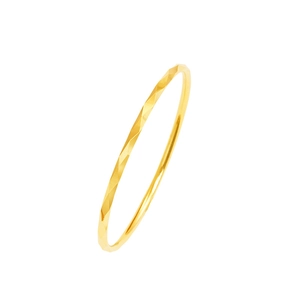 Minimalist gold copper alloy ring with geometric diamond-cut facets on white background