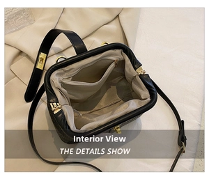 Detail view of the black doctor bag interior featuring chevron lining and zipper pocket