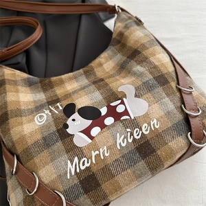 Brown plaid large capacity woolen backpack featuring a cartoon dog print and shoulder strap