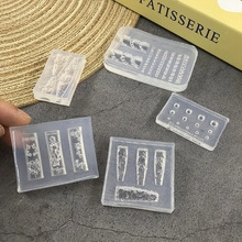 Macro shot of 3D transparent silicone nail art molds for ocean shell and bow designs