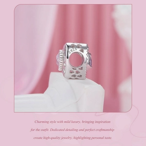 Detailed view of S925 sterling silver swan charm with pink heart cubic zirconia