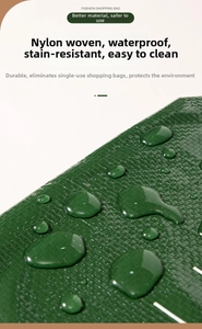 Close-up of waterproof dark green nylon woven texture showing water beads on fabric