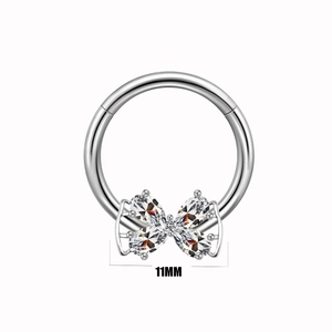 Detail of 11mm butterfly hinged segment ring with marquise-cut zircon stones