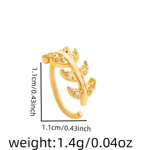 Detailed view of leaf-shaped gold ear cuff with rhinestones and size measurements