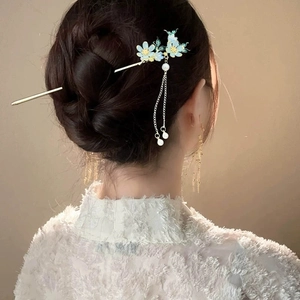 Traditional Chinese hair stick with blue enamel flowers and pearl tassels on model