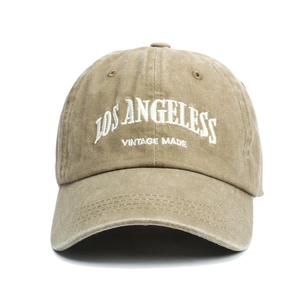 Detailed close-up of khaki washed cotton baseball cap with Los Angeles vintage embroidery