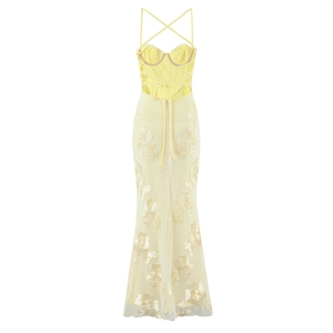 Detail of light yellow fishbone dress featuring 3D floral embroidery and lace texture
