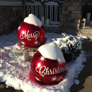 Detail of red Christmas inflatable balls with snowflake patterns and Merry Christmas text