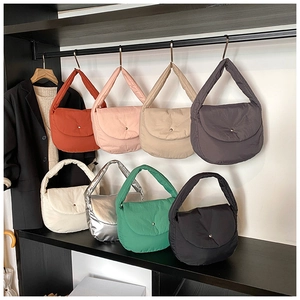 Detailed grid of padded cotton tote bags in eight colors including orange, pink and silver