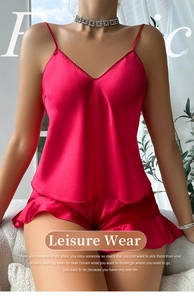 Detailed view of red satin camisole set with ruffles and glossy leisure wear texture